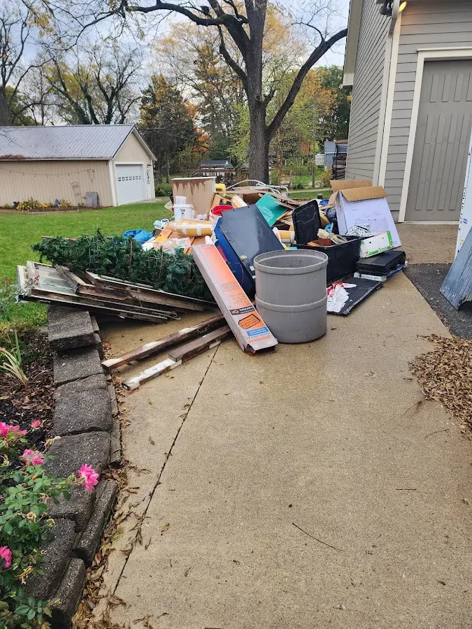 Dumpster being loaded with debris for Commercial Dumpster Rental in Carlinville